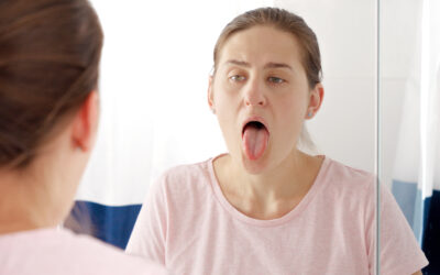 What Your Tongue Says About Your Oral Health, According to Dentists